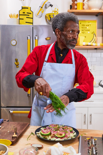 Special guest André De Shields making Beet-Cured Salmon Breakfast Salad, as seen on Breakfast with Besser, Season 1. Photo courtesy of Food Network Kitchen